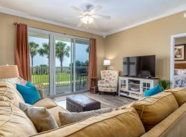 Footprints in the Sand - Beautiful first floor walk-out is only steps to the pool and beach boardwalk! condo, hotel in Dauphin Island