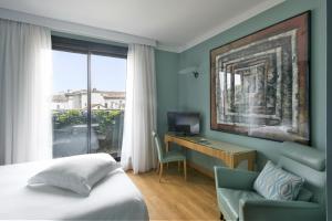 TV a/nebo společenská místnost v ubytování Hotel Spadari Al Duomo
