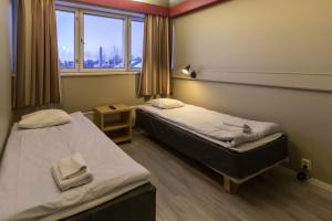 Vuode tai vuoteita majoituspaikassa Santa's Hotel Rudolf 9 kuvaa lisää