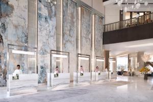 a group of people sitting in a lobby at Address Downtown in Dubai +37 photos