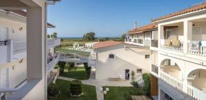arial view of an apartment building with a courtyard at Venus Hotel in Kalamaki