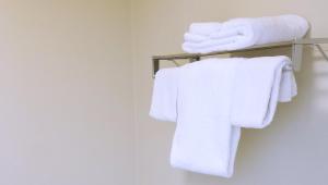 a bathroom with white towels on a towel rack at Keystone Boardwalk Inn and Suites in Keystone