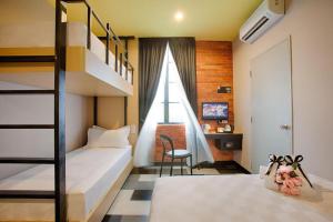 Kama o mga kama sa kuwarto sa the youniQ Hotel, KLIA T1, KLIA T2