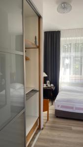 Posteľ alebo postele v izbe v ubytovaní Aparthotel Slezák
