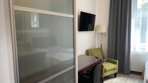 Televízia a/alebo spoločenská miestnosť v ubytovaní Aparthotel Slezák + 37 fotografií
