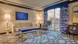 a living room with a couch and chairs and a window at Paris Las Vegas Hotel & Casino in Las Vegas