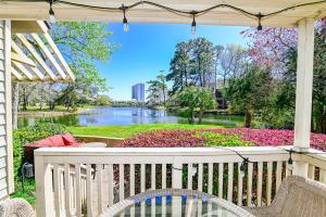 a white porch with a view of a river at Lake Bungalow Kingston Resort w Beach and Pool in Myrtle Beach