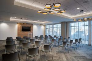 a conference room with chairs and a projection screen at EVEN Hotel Bozeman Yellowstone Intl Arpt by IHG in Belgrade +37 photos