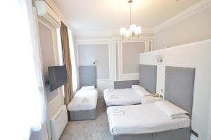 Posteľ alebo postele v izbe v ubytovaní Amber Residence Hotel-Suites