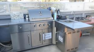 a kitchen with a stove and a sink at Sun Sea Center in Eilat +20 photos
