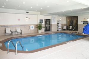 a large swimming pool in a hotel room at Holiday Inn Oklahoma City Airport by IHG in Oklahoma City