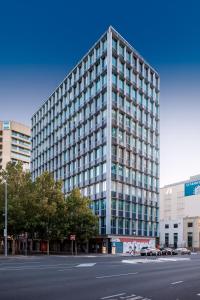 a tall building with a street in front of it at Suite 11 Victoria Square in Adelaide