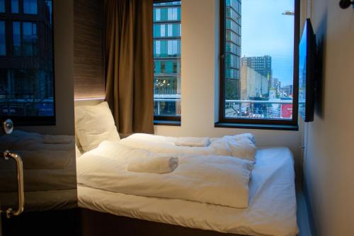 Kama o mga kama sa kuwarto sa Next House Copenhagen