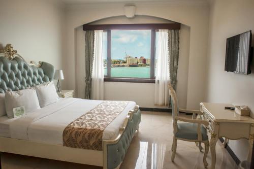 Postel nebo postele na pokoji v ubytování Golden Bay Belize Hotel