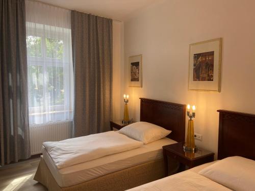 Posteľ alebo postele v izbe v ubytovaní Aparthotel Slezák