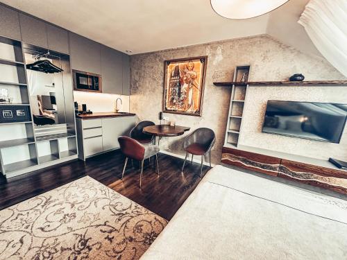 Kuchyň nebo kuchyňský kout v ubytování Alfons Boutique Hotel