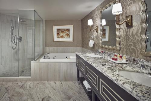 a bathroom with a tub and a sink and a shower at Paris Las Vegas Hotel & Casino in Las Vegas