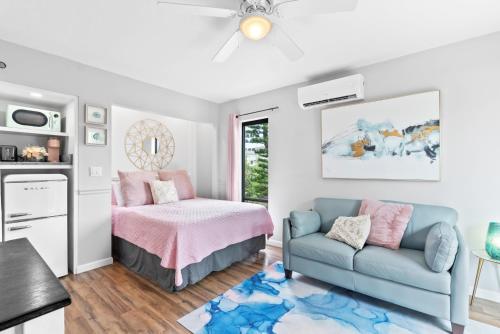 a living room with a couch and a bed at Beach Rd, 300ft to Beach Access & 500ft to Siesta Key Village, Studio in Siesta Key
