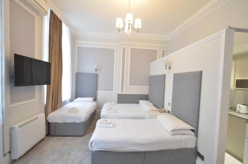 Posteľ alebo postele v izbe v ubytovaní Amber Residence Hotel-Suites