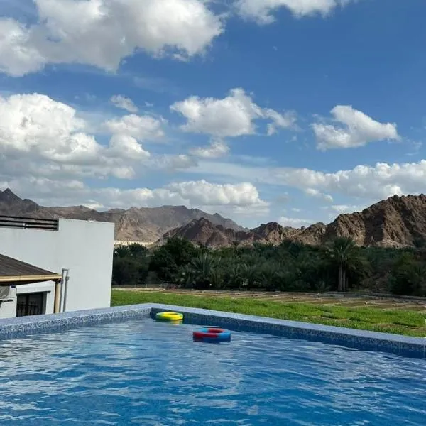 Alhara Lodge استراحة الحارة، فندق في Qimah